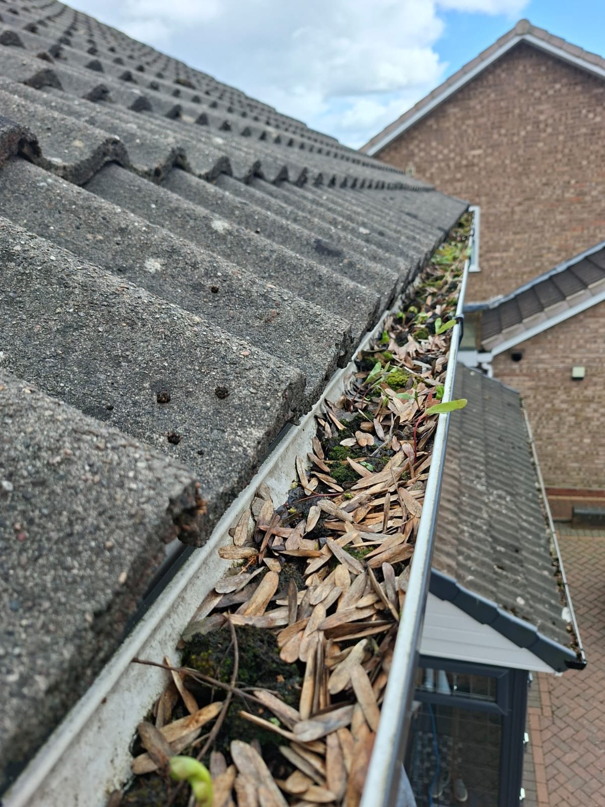 Damaged Gutter Before Repair - Leaking and Broken